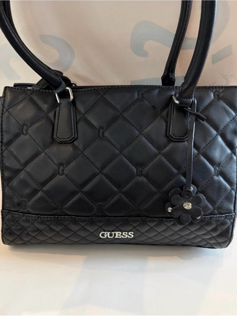GUESS Black Quilted Satchel with Floral Charm